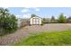 Exterior view of the backyard shed with a rock bed at 6147 Dunraven St, Golden, CO 80403
