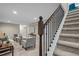Carpeted staircase leading to a cozy living area with stylish decor at 6147 Dunraven St, Golden, CO 80403