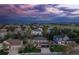 Aerial view of a residential neighborhood at dusk, showcasing the home's location at 556 Rachael Pl, Castle Pines, CO 80108