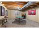 Finished basement area with a ping pong table and views of the television on the wall at 556 Rachael Pl, Castle Pines, CO 80108