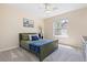 Bedroom featuring window, neutral walls, carpet, ceiling fan, and furnishings at 556 Rachael Pl, Castle Pines, CO 80108