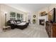 Inviting living room features a fireplace, large windows, and comfortable seating at 556 Rachael Pl, Castle Pines, CO 80108