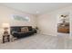 Comfortable living room features a sofa and an open entry to bedroom at 556 Rachael Pl, Castle Pines, CO 80108
