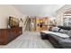 Spacious living room with stairs to upper level and open floor plan to kitchen at 556 Rachael Pl, Castle Pines, CO 80108