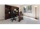 Bright office features a large desk, shelving, and a comfortable chair, perfect for working at 556 Rachael Pl, Castle Pines, CO 80108