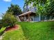 Spacious backyard featuring a deck, porch swings, and well-maintained lawn at 8425 Green Island Cir, Lone Tree, CO 80124