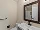 Bathroom featuring a single sink vanity and decorative framed mirror at 8425 Green Island Cir, Lone Tree, CO 80124