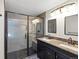 Updated bathroom with a glass enclosed shower and double sink vanity at 8425 Green Island Cir, Lone Tree, CO 80124