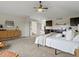 Open bedroom featuring a kitchenette, stylish decor, and an attached bathroom at 8425 Green Island Cir, Lone Tree, CO 80124