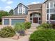 Charming two-story home featuring a three car garage and manicured landscaping at 8425 Green Island Cir, Lone Tree, CO 80124