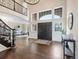Stately foyer featuring high ceilings, hardwood floors, and a large entryway with transom windows at 8425 Green Island Cir, Lone Tree, CO 80124