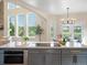 Open kitchen with an island, modern appliances, and stunning outdoor views at 8425 Green Island Cir, Lone Tree, CO 80124
