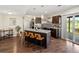 Modern kitchen with granite counters, stainless appliances, and island seating at 8425 Green Island Cir, Lone Tree, CO 80124