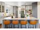 Open kitchen features a large island with seating and stainless steel appliances at 8425 Green Island Cir, Lone Tree, CO 80124