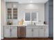 Modern kitchen with white cabinets, stainless steel appliances, and a subway tile backsplash at 8425 Green Island Cir, Lone Tree, CO 80124