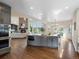 Open concept kitchen with stainless steel appliances, a large island, and views of the living room and yard at 8425 Green Island Cir, Lone Tree, CO 80124