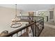 Open landing with decorative iron railings, stylish lighting, and views to the yard at 8425 Green Island Cir, Lone Tree, CO 80124