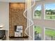 Stunning chandelier over the fireplace in the living room with large windows at 8425 Green Island Cir, Lone Tree, CO 80124