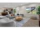 Comfortable living room space open to kitchen and outdoor view at 8425 Green Island Cir, Lone Tree, CO 80124