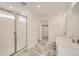 Main bathroom with double vanity and shower at 5581 Wisteria Ave, Firestone, CO 80504