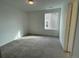 Bright bedroom with carpet, a window, and neutral wall colors at 5581 Wisteria Ave, Firestone, CO 80504