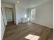 Versatile bonus room with wet bar and light wood flooring at 5581 Wisteria Ave, Firestone, CO 80504