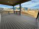 Covered deck overlooking a community under construction and open space at 5581 Wisteria Ave, Firestone, CO 80504