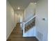 Bright entryway with hardwood floors and staircase at 5581 Wisteria Ave, Firestone, CO 80504