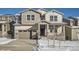 Two-story house with gray siding, a large garage, and snowy landscaping at 5581 Wisteria Ave, Firestone, CO 80504