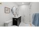 Bathroom featuring a double sink vanity, dual mirrors, and modern fixtures at 2341 Poze Blvd, Thornton, CO 80229