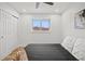 Bedroom featuring light wood floors, a ceiling fan, a bright window, and closet at 2341 Poze Blvd, Thornton, CO 80229