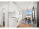 Stylish kitchen featuring an adjacent dining area with modern fixtures and sleek design at 2341 Poze Blvd, Thornton, CO 80229