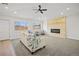 Bright living room with modern fireplace, fan and carpeted floors at 2341 Poze Blvd, Thornton, CO 80229