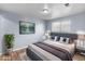 Bedroom features wood flooring, large window, and blue painted walls at 1155 S Fairplay Cir # D, Aurora, CO 80012