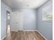 Bedroom with wood floors, window and closet, painted with a light-blue color at 1155 S Fairplay Cir # D, Aurora, CO 80012