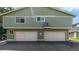 Exterior of the home with two garage doors and assigned parking at 1155 S Fairplay Cir # D, Aurora, CO 80012