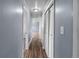 The hallway features blue walls, wood-look flooring, and access to multiple rooms at 1155 S Fairplay Cir # D, Aurora, CO 80012