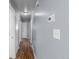 Long hallway with wood floors and access to multiple rooms and closets at 1155 S Fairplay Cir # D, Aurora, CO 80012