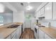 An efficient kitchen with an open layout, white cabinets, and modern appliances at 1155 S Fairplay Cir # D, Aurora, CO 80012