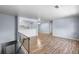 Spacious living room with hardwood floors adjacent to kitchen and dining areas at 1155 S Fairplay Cir # D, Aurora, CO 80012