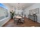 Bright dining room with modern chandelier and easy access to updated kitchen at 3315 N Josephine St, Denver, CO 80205