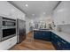 Modern kitchen with stainless appliances, gas cooktop, and open floorplan at 3315 N Josephine St, Denver, CO 80205