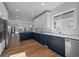 Bright kitchen with modern blue cabinets, white quartz countertops, and stylish fixtures at 3315 N Josephine St, Denver, CO 80205