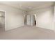 Spacious bedroom features neutral tones and multiple doorways, offering versatility and accessibility at 8983 E Nichols Pl, Centennial, CO 80112