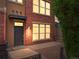 Charming red brick townhouse with a private entrance and manicured landscaping at 8983 E Nichols Pl, Centennial, CO 80112