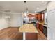 Open-concept kitchen with granite countertops, stainless steel appliances, and ample cabinet space at 8983 E Nichols Pl, Centennial, CO 80112