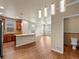 Eat-in kitchen with granite island, stainless steel appliances, and adjacent dining area at 8983 E Nichols Pl, Centennial, CO 80112