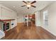 Open-concept living room, showing kitchen, dining, and fireplace at 8983 E Nichols Pl, Centennial, CO 80112