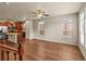 Inviting living room featuring hardwood floors, a ceiling fan, and an abundance of natural light at 8983 E Nichols Pl, Centennial, CO 80112