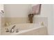 Soaking tub decorated with candles and flowers in bathroom at 3000 E 112Th Ave # 102, Northglenn, CO 80233